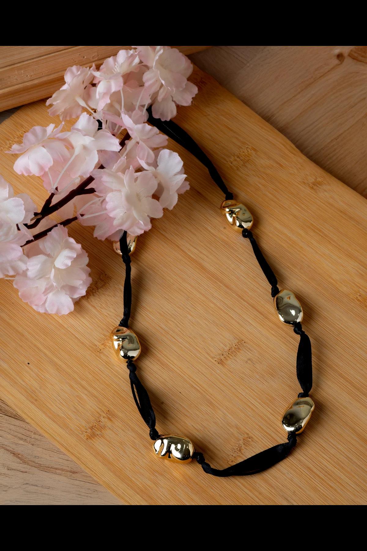 gold-bead-and-black-cord-statement-necklace