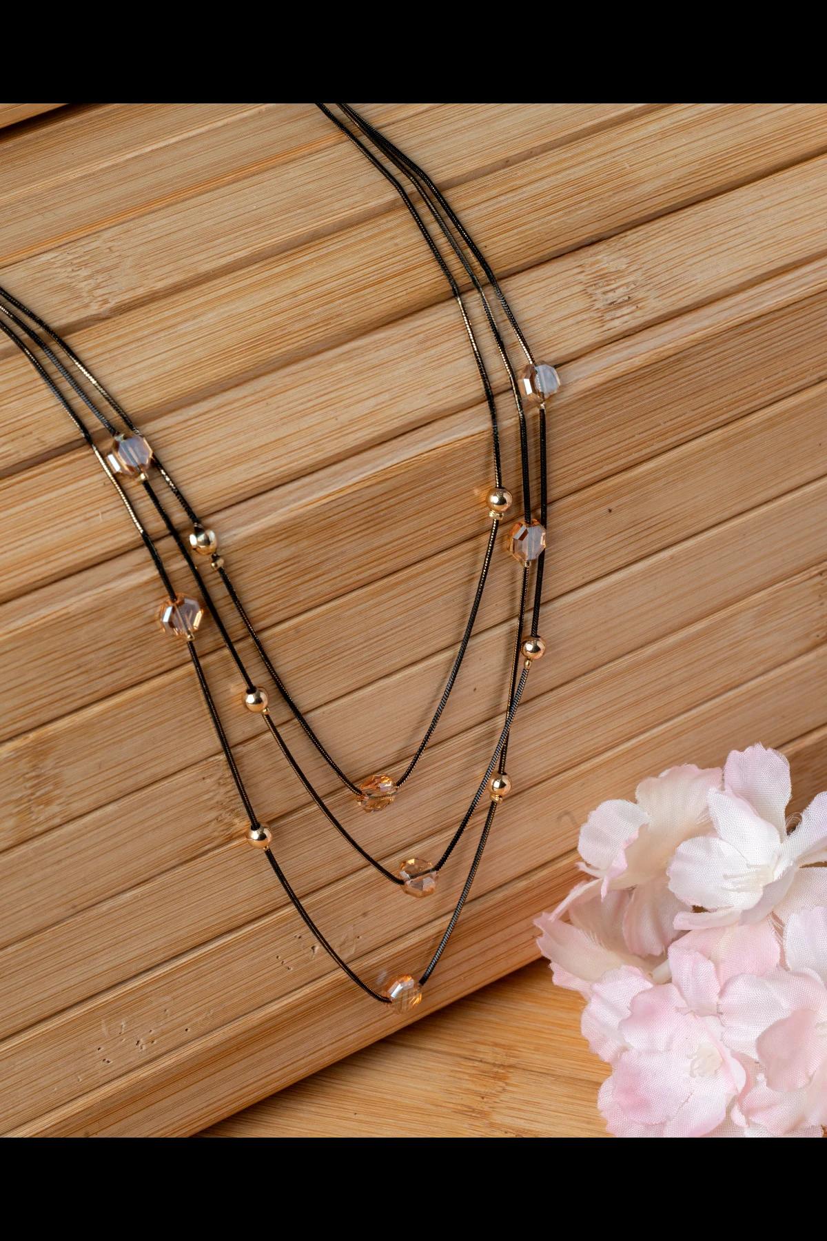 fourstrand-gold-and-black-bead-layered-necklace